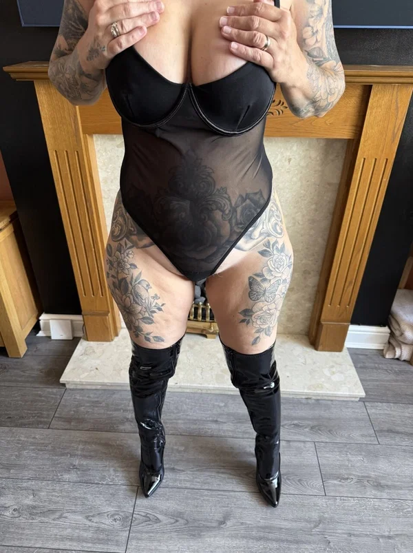 Tattooed blonde Inked MILF removes a black bodystocking in thigh-high boots  - Curvy, Hairy, Boots, Mature, Chubby, Latex, Thick, Tattoo, Big Tits, BBW  - Photo 6