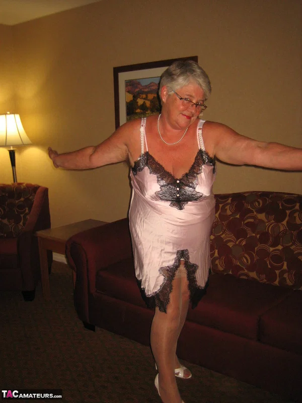 Old amateur Girdle Goddess lets her boobs loose while on a chesterfield  - Granny, BBW, Glasses, Stockings, Chubby, Amateur, Short Hair, High Heels, Curvy, Skirt  - Photo 10