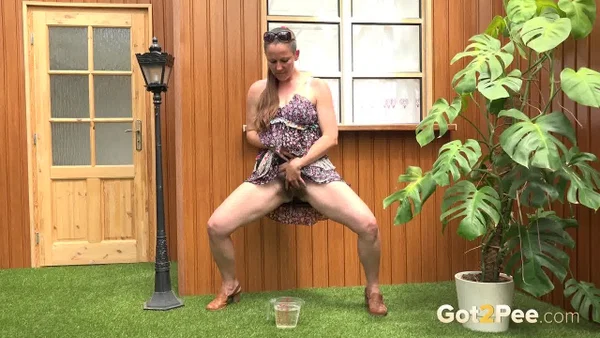 Blonde woman Nicol D hikes short dress to pee standing behind the house  - Public, Pissing, Hairy, Spreading, Legs, Babe, Upskirt, Close Up, Skirt, Clothed  - Photo 13