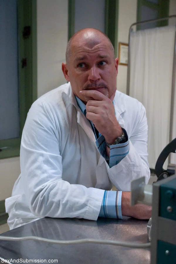 Bald doctor examines naked body of good-looking assistant in people's presence  - Brunette, Non Nude  - Photo 6
