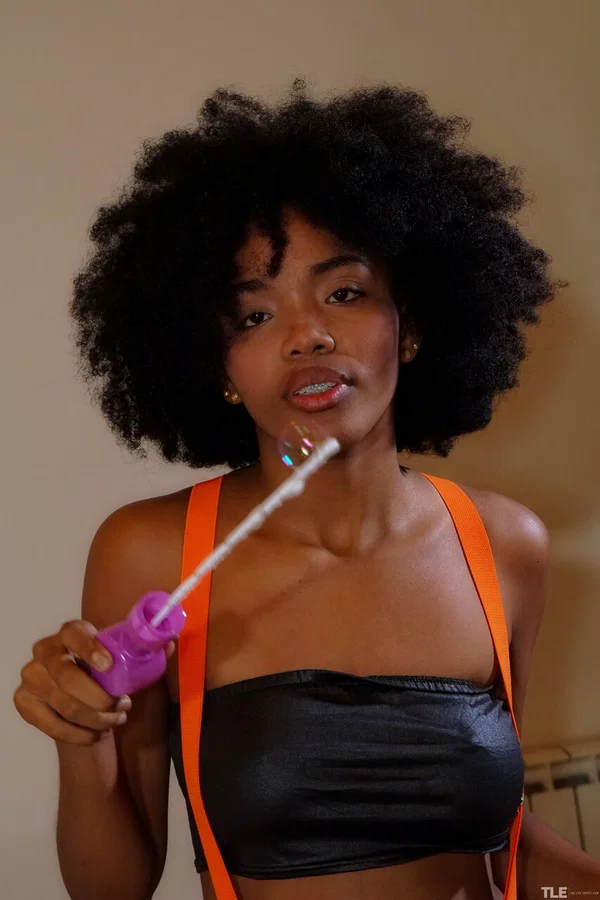 Cute black teen with a big afro masturbates with a sex toy on a bed  - Erotic, Lesbian, Cute, Teen, Glamour, Model  - Photo 1