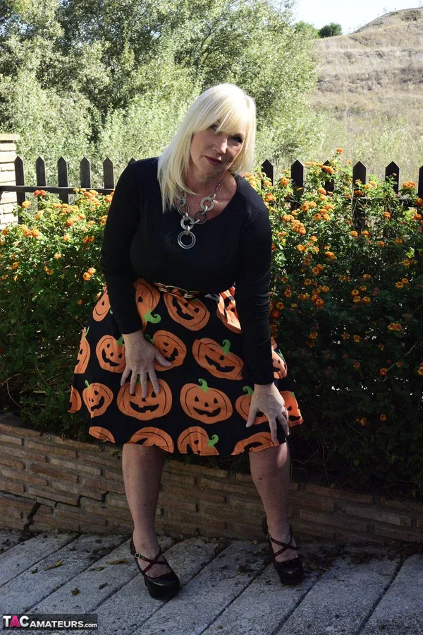 Mature blonde Melody exposes her bra and panties while dressed for Halloween  - Halloween, Mature, Clothed, Skirt, Outdoor, Ass, Upskirt, High Heels, PAWG, Amateur  - Photo 7