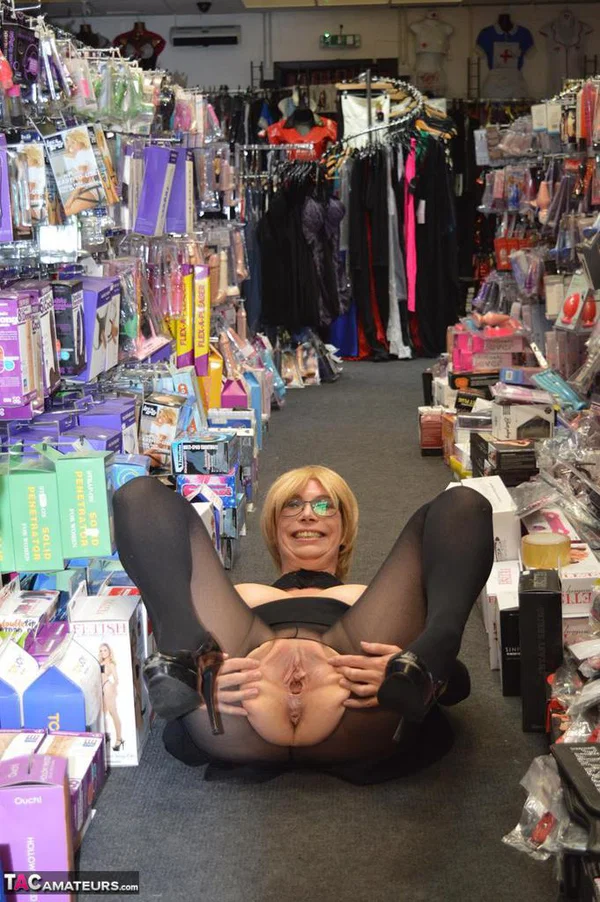 Mature woman flashes her tits and twat on sidewalk and in sex shop  - Mature, British, Amateur, Pantyhose, Glasses, Public, Spreading, Big Tits, Outdoor, Natural Tits  - Photo 19