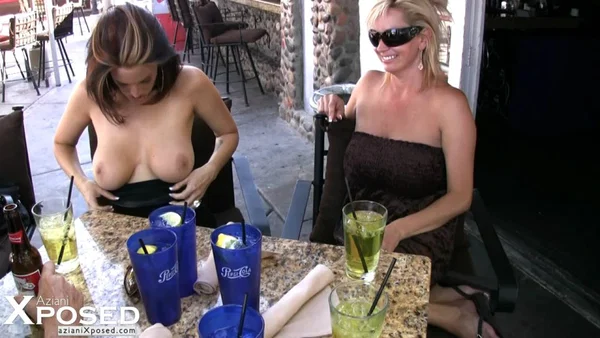 Pornstars Nikki Novam & Rachel Aziani expose tits and twats at an outdoor cafe  - Public, MILF, Pornstar, Reality, Mature, Hairy, Glasses, Redhead, Spreading, Skirt  - Photo 13