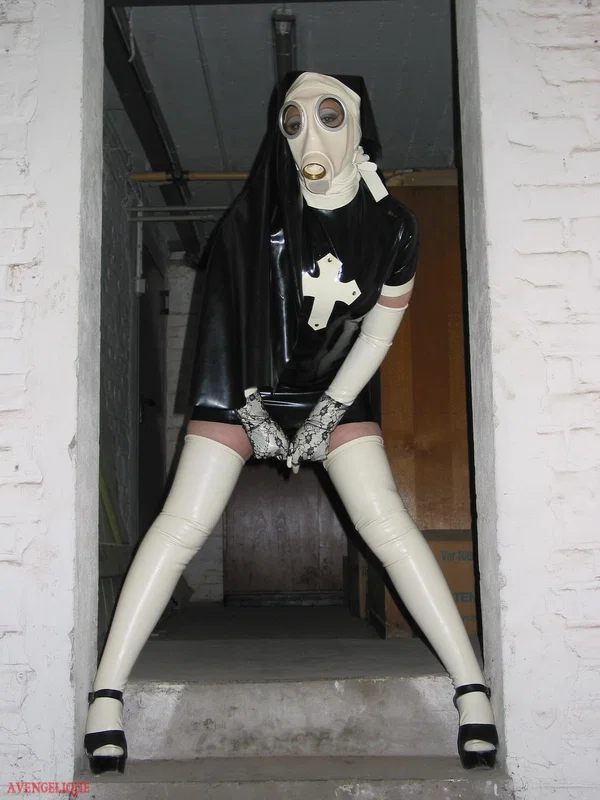 Solo model Avengelique sports a gas mask while wearing latex Nun clothing  - Nun, Latex, Skirt, Fetish, Uniform, Stockings, Clothed, High Heels, PAWG, Legs  - Photo 2