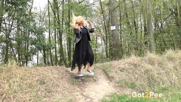 Blonde girl Jenna Lovely takes a piss while descending a bank near the woods  - Pissing, MILF, Outdoor, Spreading, Pussy, Panties, Close Up, Shaved, Clothed, Skirt  - Photo 15