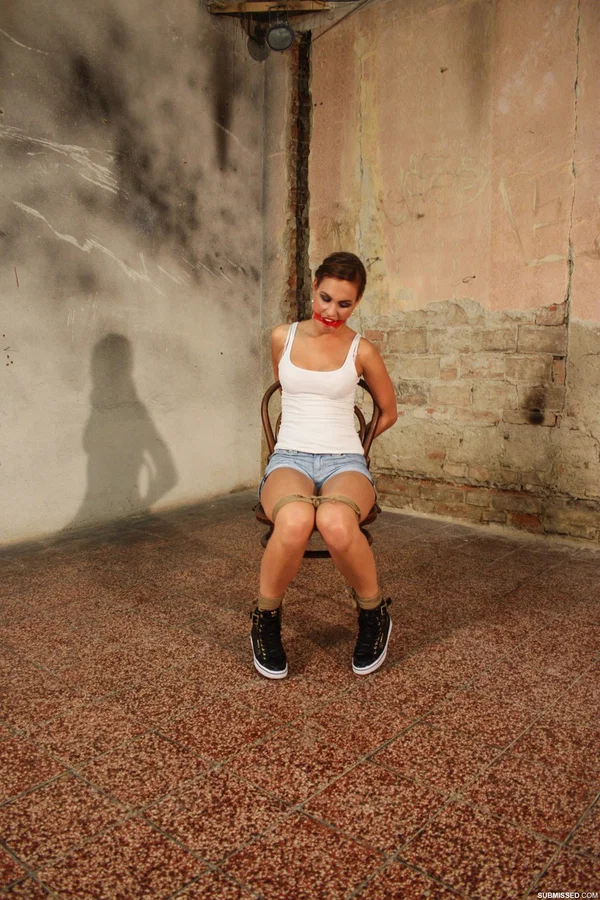 Gorgeous brunette poses tied to a chair in jean shorts and a white tank top  - Bondage, BDSM, Brunette  - Photo 10