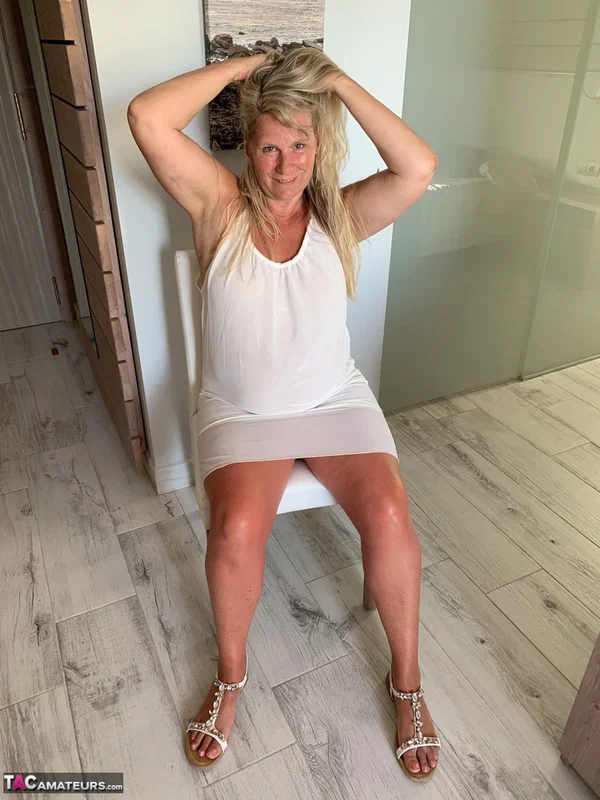 Thick older woman Sweet Susi exposes tan lined tits after hiking up her dress  - BBW, Mature, Chubby, Thick, Saggy Tits, MILF, Curvy, Amateur, Clothed, Spreading  - Photo 2
