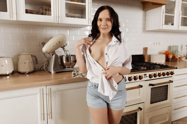 Dark haired girl gets completely naked before displaying her spread pussy  - Hairy, Babe, Brunette, Beautiful, Pussy, Shorts, Solo, Kitchen, Clothed, Tiny Tits  - Photo 4