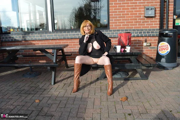 Older woman Barby Slut flashes while out and about in the British Isles  - Boots, Amateur, MILF, Big Tits, Natural Tits, Glasses, Outdoor, Public, Clothed, Spreading  - Photo 11