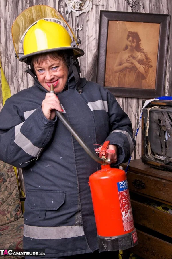 Mature fatty doffs her firefighter clothing to show her twat in stockings  - Mature, BBW, Amateur, Stockings, Brunette, Short Hair, Chubby, Uniform, European, Clothed  - Photo 6