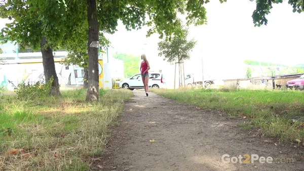 Blonde girl Debora pees on a dirt path during the middle of a sunny day  - Pissing, Public, Pussy, Outdoor, Glasses, Blonde, Shaved, Spreading, Close Up, Shorts  - Photo 1