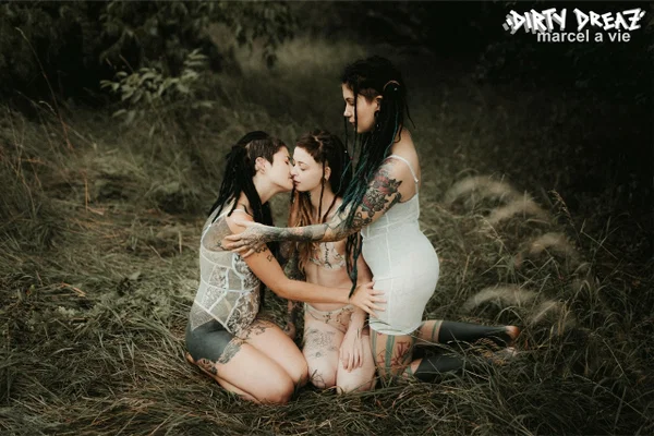 Three tattooed girls share lesbian kisses in long grass near a fir tree  - Tattoo, Humping, Threesome, Fetish, Lesbian, Ass, Ass Licking, Outdoor, Pigtails, Kissing  - Photo 12