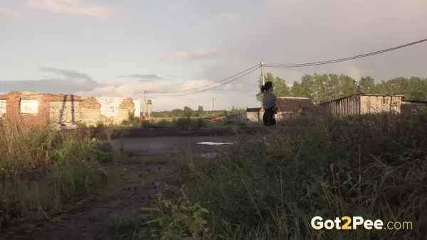 Leggy girl Kristina takes a piss behind a dilapidated building  - Pissing, Public, Outdoor, Skirt, Upskirt, Beautiful, Pussy, Solo, Shaved, Ass  - Photo 15
