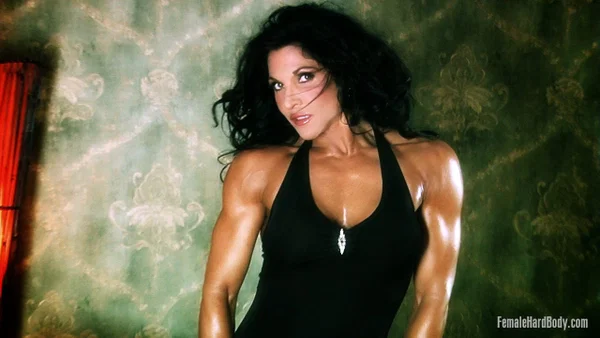 Dark haired bodybuilder Tracy Daniels shows her tight ass in upskirt mode  - Oiled, MILF, Upskirt, Clothed, Ass, PAWG, Brunette, Legs  - Photo 1