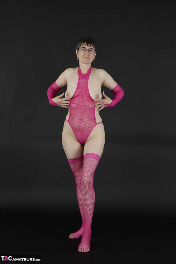 Mature amateur gets naked in pink arm socks and stockings with her glasses on  - Saggy Tits, Mature, Glasses, Short Hair, Lingerie, Amateur, Stockings, Brunette, European  - Photo 5