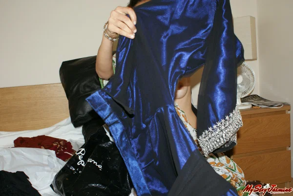 Indian girl Jasmine exposes a breast while sorting thru her clothes on a bed  - Indian, Party, Babe, Clothed, Tiny Tits, Skinny, Beautiful, Solo  - Photo 3