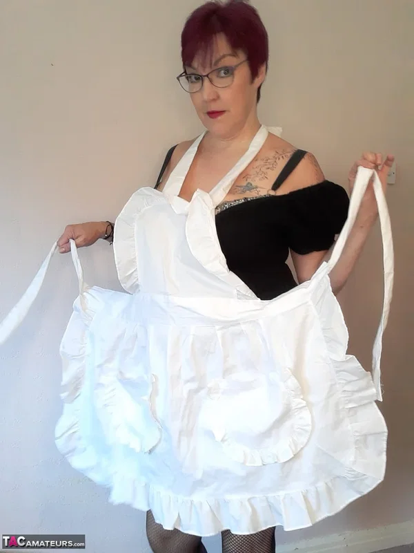 Older maid with short red hair Layla Bird toys her shaved pussy while at work  - Mature, Maid, BBW, Curvy, Chubby, Saggy Tits, Redhead, Short Hair, Stockings, Big Tits  - Photo 13