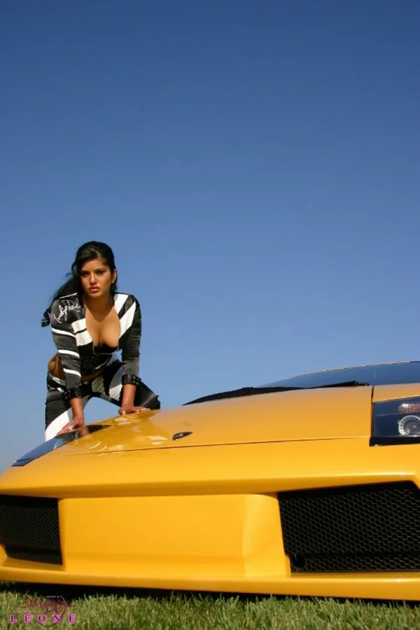 Hot Sunny Leone appears in racing-girl uniform and strips by the sportcar  - Indian, MILF, Pornstar, Outdoor, Solo, Big Tits, Beautiful, Fake Tits, Babe, Spreading  - Photo 5