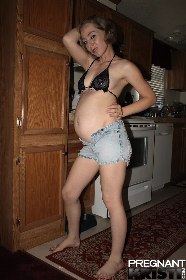 Heavily pregnant girl doffs bikini top and denim shorts to model totally naked  - Pregnant, Amateur, Shorts, Kitchen, Babe, Ass, Tiny Tits, Undressing, Solo, Beautiful  - Photo 1