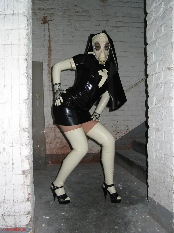Solo model Avengelique sports a gas mask while wearing latex Nun clothing  - Nun, Latex, Skirt, Fetish, Uniform, Stockings, Clothed, High Heels, PAWG, Legs  - Photo 10