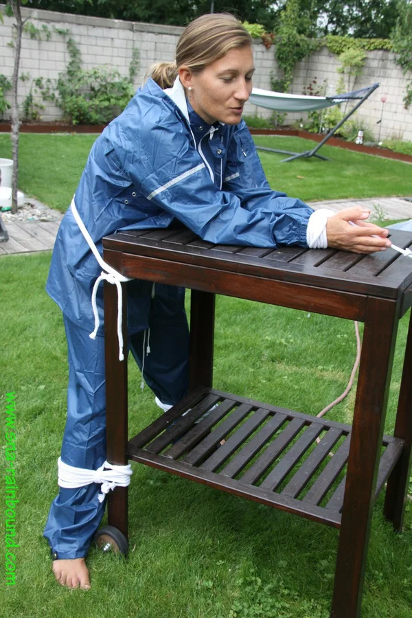 Caucasian woman is tied to a table in a yard with panties over her face  - Amateur, BDSM, Outdoor, Bondage, Non Nude, Clothed, Ass, PAWG  - Photo 1