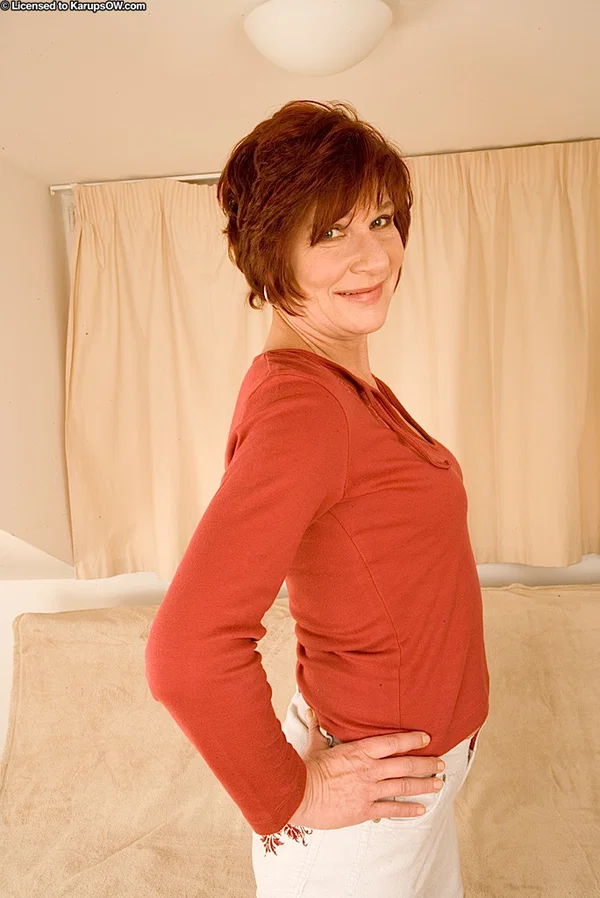 Sassy redhead mature lady undressing and spreading her legs  - Mature, Lingerie, Spreading, Tiny Tits, Undressing, Clothed, Pussy, Ass, Short Hair, Big Clit  - Photo 1