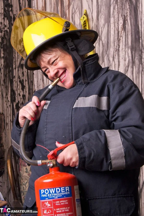 Mature fatty doffs her firefighter clothing to show her twat in stockings  - Mature, BBW, Amateur, Stockings, Brunette, Short Hair, Chubby, Uniform, European, Clothed  - Photo 8