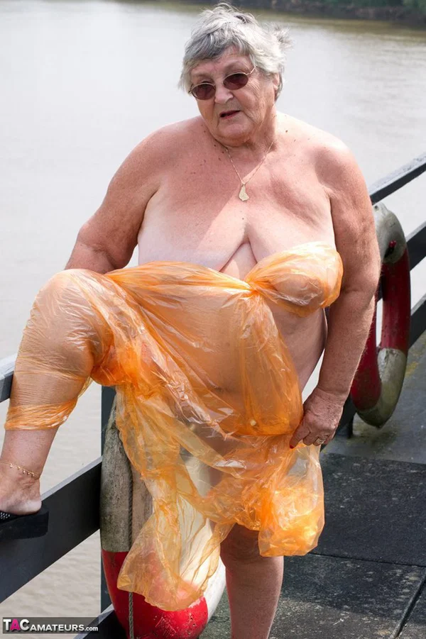Obese oma Grandma Libby doffs a see-through raincoat to get naked on a bridge  - SSBBW, Granny, Saggy Tits, BBW, Chubby, Amateur, Curvy, Fetish, Thick, Glasses  - Photo 15
