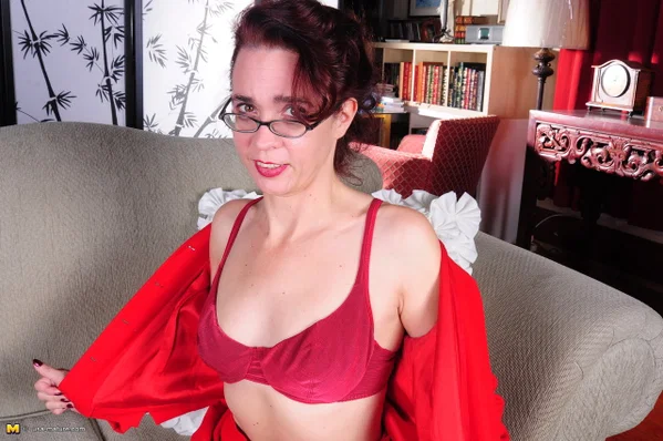 Mature American housewife removes her red dress to model in her lingerie  - Mature, Glasses, Babe, Skirt, Clothed, MILF, Undressing, Lingerie, Ass, Legs  - Photo 12
