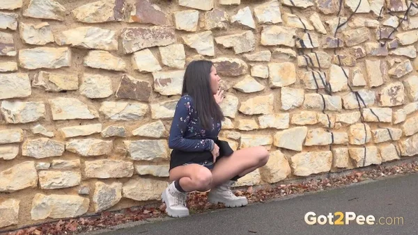 Mini Mitzi squats against a stone wall to take a badly needed piss  - Public, Petite, Outdoor, Spreading, Close Up, Pussy, Skirt, European, Czech, Non Nude  - Photo 5
