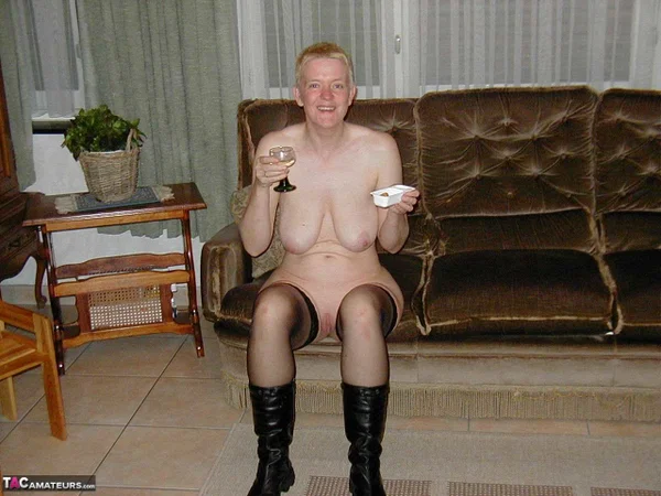 Mature blonde Tiffany Pearl gets naked on a sofa in stockings and black boots  - Mature, Saggy Tits, Chubby, Short Hair, Amateur, Curvy, Boots, BBW, Leather, Thick  - Photo 11