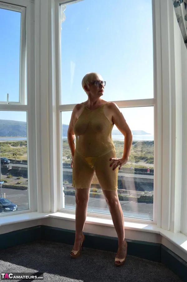 Big titted older woman Barby Slut showcases her bald twat in front of a window  - Mature, Glasses, BBW, Skirt, Thick, Chubby, Curvy, Short Hair, Legs, Spreading  - Photo 4