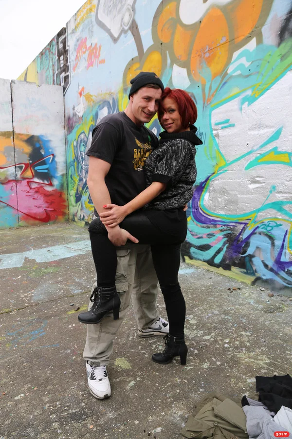 Kinky German MILF Jolyne Joy gets her big tits massaged by a photographer  - German, Mature, Short Hair, MILF, Redhead, Big Tits, Outdoor, High Heels, Clothed, Pornstar  - Photo 2