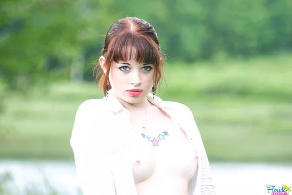 Amateur girl with red hair Barbie A exposes her tits while in a grassy field  - Amateur, Outdoor, Redhead, Clothed, Pigtails, Legs, Skirt, Big Tits, Upskirt, Tattoo  - Photo 8