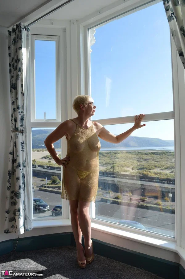 Big titted older woman Barby Slut showcases her bald twat in front of a window  - Mature, Glasses, BBW, Skirt, Thick, Chubby, Curvy, Short Hair, Legs, Spreading  - Photo 8