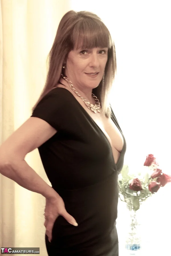 Mature woman Dirty Doctor covers up her naked tits while wearing sexy heels  - Mature, Clothed, British, Amateur, Natural Tits, Skirt, Close Up, Big Tits, High Heels, Feet  - Photo 1