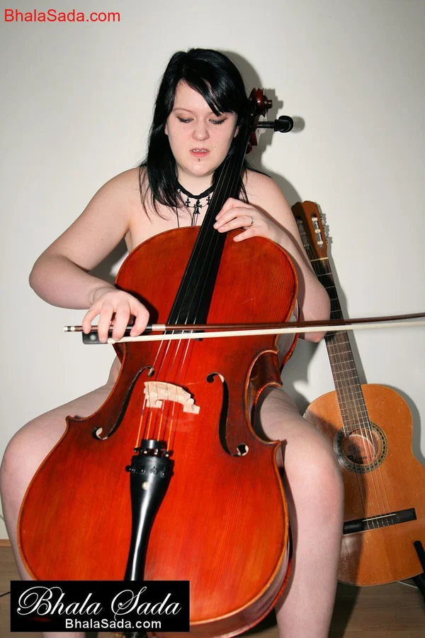 Raven-haired MILF Bhala Sada sitting in a chair playing the cello in the nude  - MILF, Non Nude, Beautiful, Brunette, Babe, Solo  - Photo 6