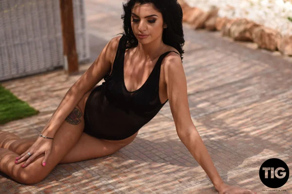 Hot black haired babe Sarah Long removes her bodysuit and exposes her tits  - Bikini, Outdoor, Glamour, British, Babe, Model, High Heels, European, Beautiful, Ass  - Photo 4