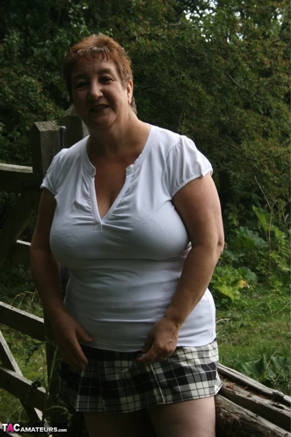 Fat British lady Kinky Carol unleashes her large breasts over a rustic fence  - Mature, Thick, BBW, Chubby, British, Outdoor, Upskirt, Saggy Tits, Curvy, Clothed  - Photo 4