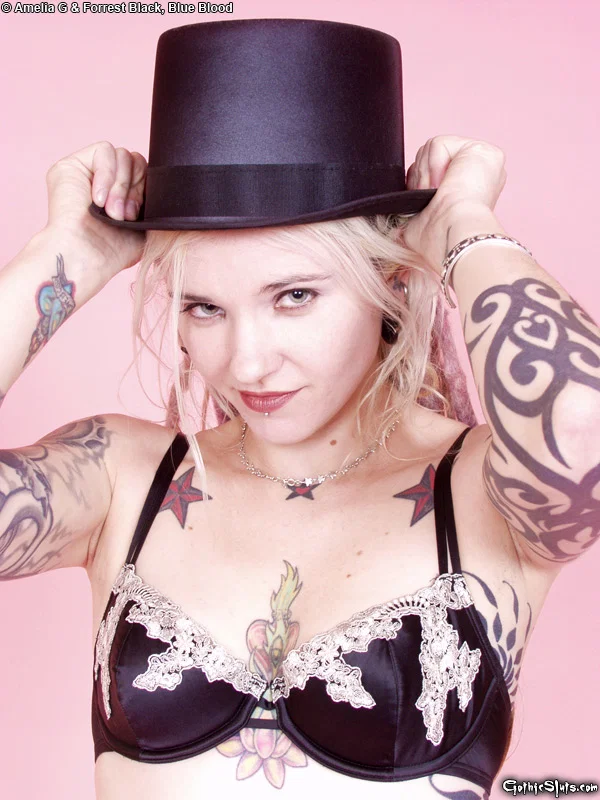 Tattooed blonde Voltaire Blue doffs a top hat while getting naked in heels  - Tattoo, Fetish, Upskirt, Skirt, High Heels, Ass, PAWG, Panties, Tiny Tits, Babe  - Photo 1