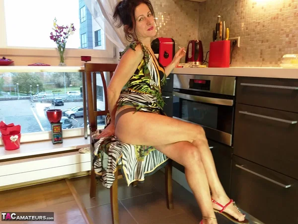 Leggy mature woman Diana Ananta fingers her hairy pussy atop a foot stool  - Mature, Clothed, Amateur, Legs, Brunette, Spreading, Hairy, Lingerie, Fingering, Tiny Tits  - Photo 6