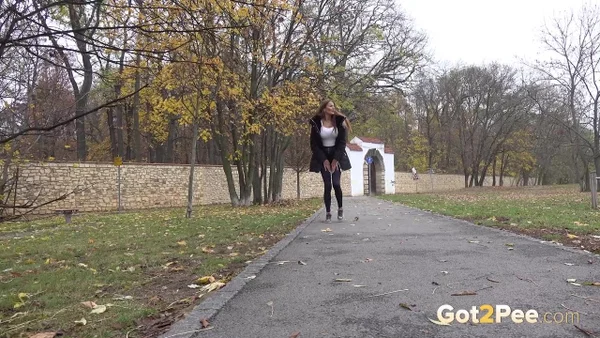 Caucasian girl Maddi Black takes a piss up against a tree in a park  - Pissing, Public, Pussy, Outdoor, European, Close Up, Beautiful, Babe, Non Nude, Solo  - Photo 1