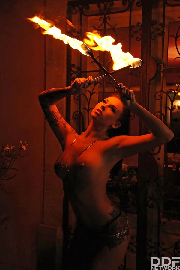 Femdom Daniela gives an outdoor fire-play performance with her big boobs bared  - Fetish, Outdoor, Panties, British, Beautiful, High Heels, Babe, Solo, European, Pretty  - Photo 1