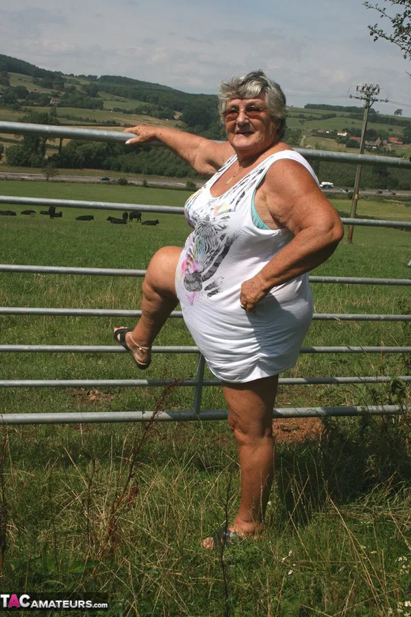 Old British woman Grandma Libby exposes herself next to a field of cattle  - Granny, BBW, Big Tits, Saggy Tits, Outdoor, Glasses, Amateur, European, Chubby, Curvy  - Photo 1