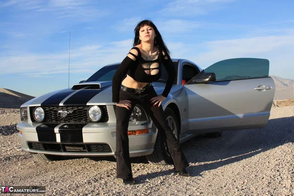 Brunette amateur Susy Rocks models by a muscle car during a safe for work gig  - Outdoor, Tall, Ass, Amateur, PAWG, Beautiful, Solo, Brunette, Non Nude  - Photo 6