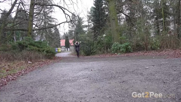 White girl Cynthia Vellons squats to take a piss next to an isolated building  - Pissing, Public, MILF, Boots, Spreading, Pussy, Outdoor, Czech, Close Up, Shaved  - Photo 1