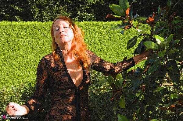 Redhead amateur Kyras Nylons tends to her garden in sheer attire and nylons  - Outdoor, Amateur, MILF, Lingerie, Stockings, Babe, High Heels, Beautiful, European, Ass  - Photo 14