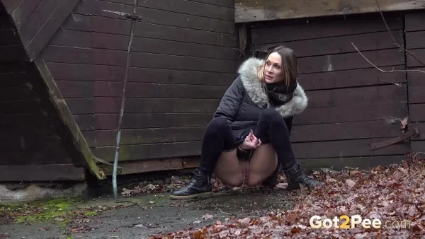 White girl Cynthia Vellons squats to take a piss next to an isolated building  - Pissing, Public, MILF, Boots, Spreading, Pussy, Outdoor, Czech, Close Up, Shaved  - Photo 11