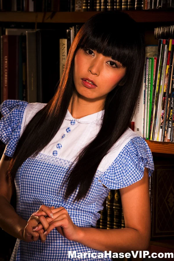 Japanese female Marica Hase flashes her panties while taking a book from stack  - Asian, Japanese, Non Nude, Beautiful, MILF, Babe, Clothed, Skinny, Pornstar, Face  - Photo 2
